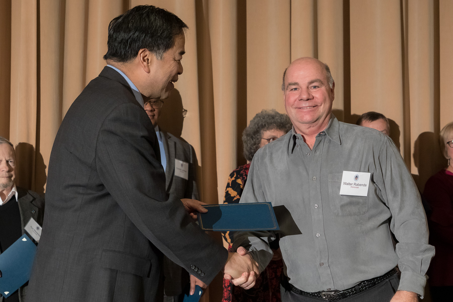 Walter Rabenda, right, with A. Gabriel Esteban, Ph.D., president, as faculty and staff members are inducted into DePaul University's 25 Year Club, Tuesday, Nov. 13, 2018, at the Lincoln Park Student Center. Employees celebrating their 25th work anniversary were honored at the luncheon with their colleagues and will have their names added to plaques located on the Loop and Lincoln Park Campuses. (DePaul University/Jeff Carrion)